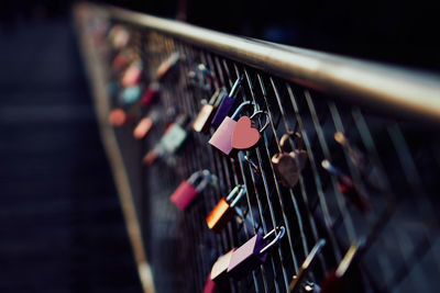 Close-up of padlocks on railing