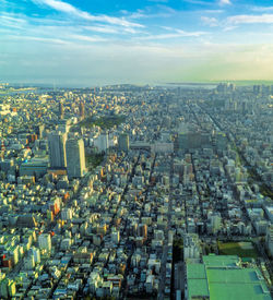 High angle view of city buildings against sky