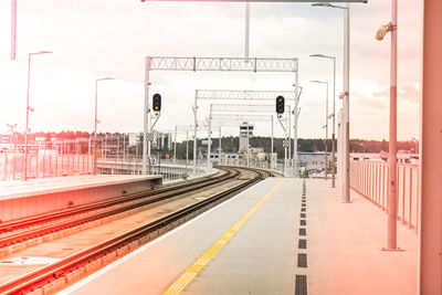 Walk way in train station with no people. empty passanger train railway station platform. sign board