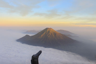 Scenic view of volcanic landscape against sky during sunset