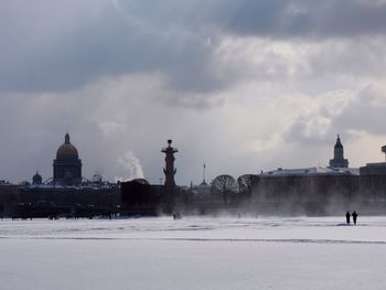 View of buildings against sky during winter