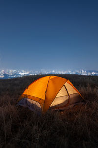 Tent on field against sky