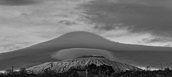 Scenic view of volcanic mountain against sky