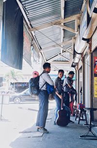 Full length of young couple on road