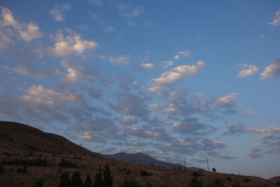 Scenic shot of calm sea against mountain range