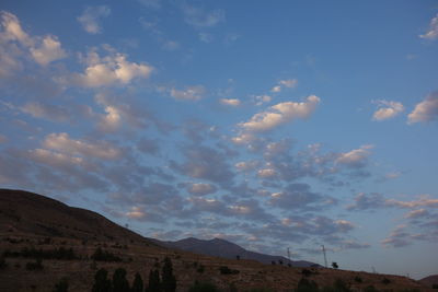 Scenic shot of calm sea against mountain range