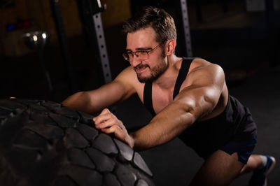 Young exercising at gym