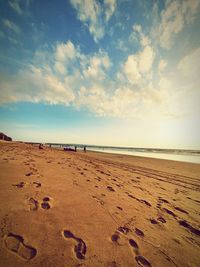 Surface level of beach against sky