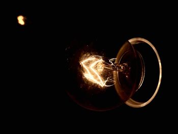 Close-up of illuminated light bulb