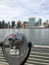 View of cityscape against sky binoculars 