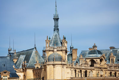 Buildings in city against sky