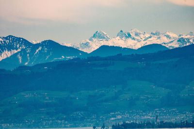 Scenic view of snowcapped mountains against sky