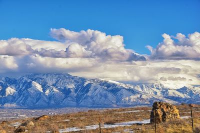 Scenic view of snowcapped mountains against sky