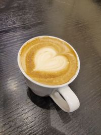 High angle view of cappuccino on table