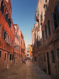 Street amidst buildings against sky