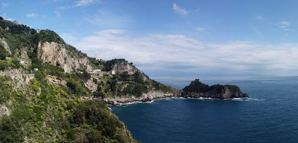 Scenic view of mountains and sea against sky