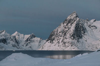 Scenic view of snowcapped mountains against sky during winter