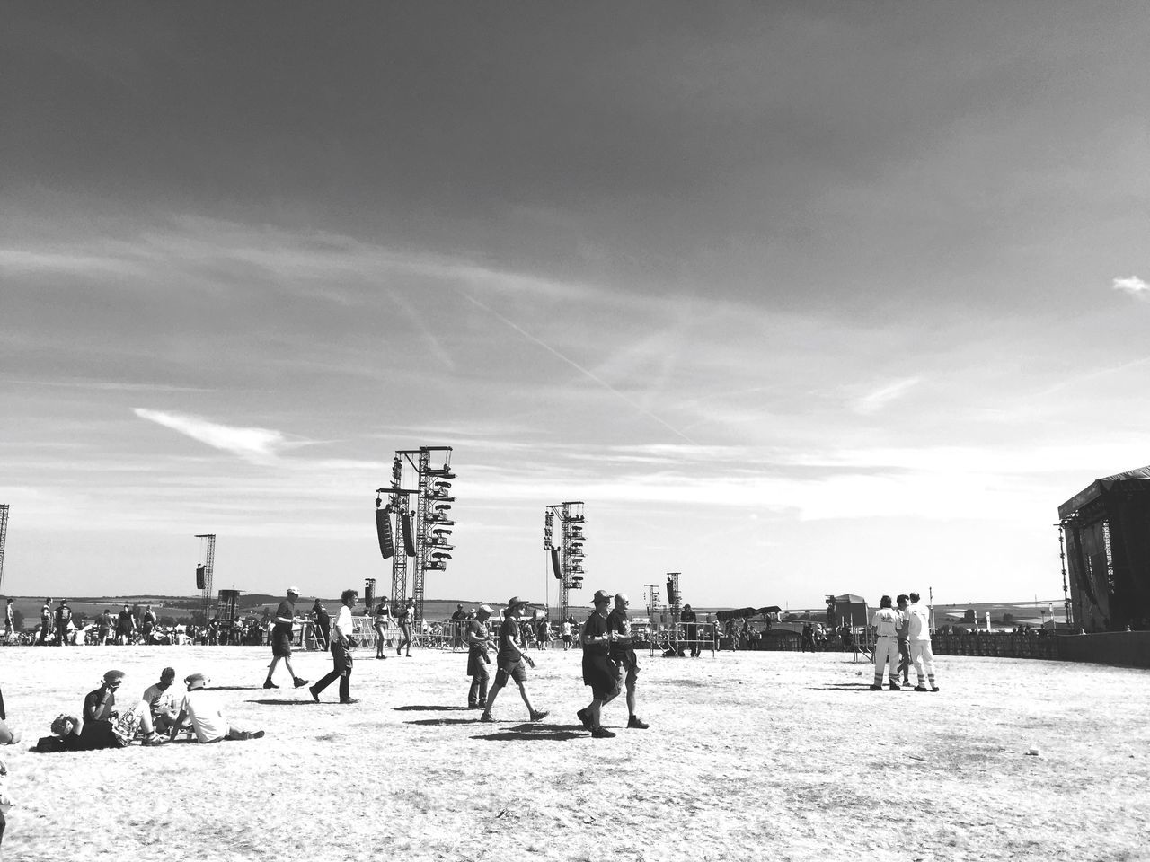 large group of people, lifestyles, beach, leisure activity, person, men, sky, mixed age range, sea, enjoyment, vacations, sand, shore, cloud - sky, tourist, water, weekend activities, fun, built structure