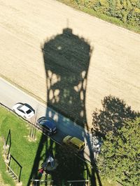 High angle view of shadow of man on bicycle