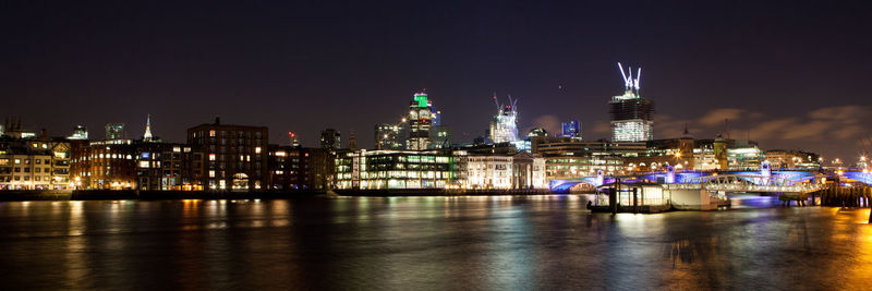 Illuminated buildings in city at night