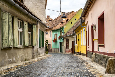 Narrow alley amidst buildings in town, sibiu, romania