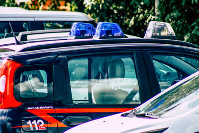 Car in city seen through window