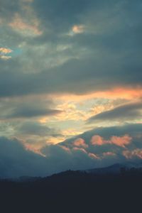 Silhouette of landscape against dramatic sky