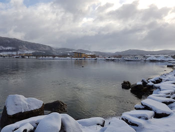 Scenic view of frozen lake against sky