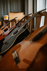 High angle view of guitars on chairs
