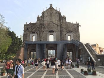 Group of people in front of historical building