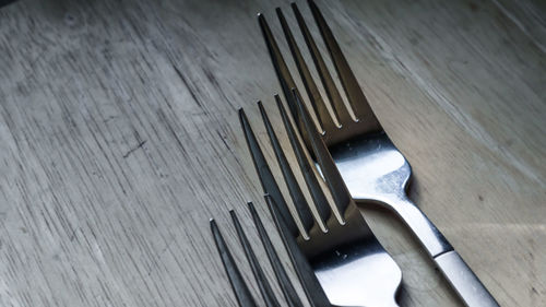 High angle view of piano keys on wooden table