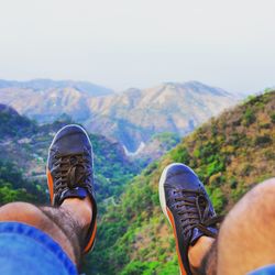 Low section of man against mountains