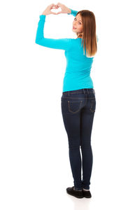 Woman standing against white background