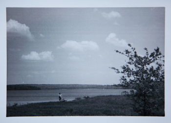 Scenic view of landscape against cloudy sky