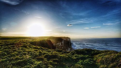 Scenic view of sea against sky at sunset