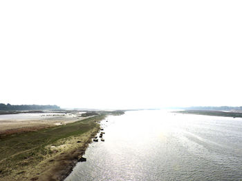 Scenic view of beach against clear sky