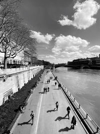 High angle view of people on road by river