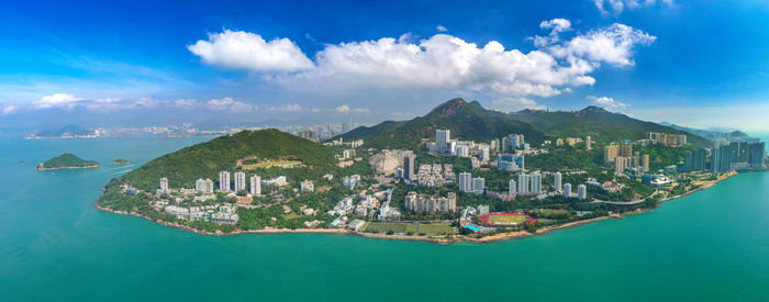 Panoramic view of sea and buildings against sky