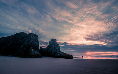 Scenic view of seastacks against sky during sunset