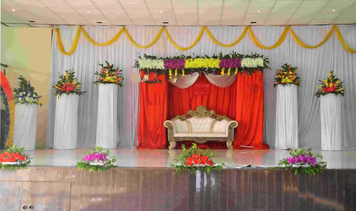 Flower pots on table against wall