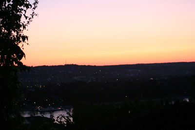 Scenic view of silhouette landscape against sky at sunset