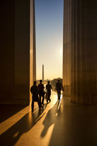 People walking in front of building