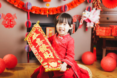 Cute girl standing in traditional clothing