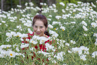 Portrait of a smiling woman on field