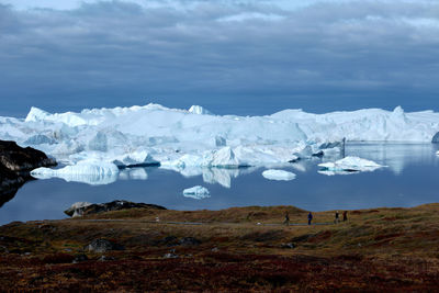 Scenic view of frozen lake against sky