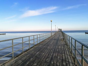Pier over sea against sky