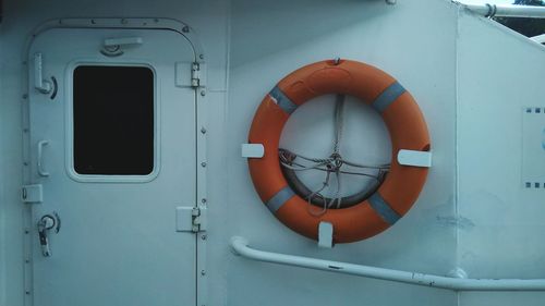 Close-up of life belt hanging in boat