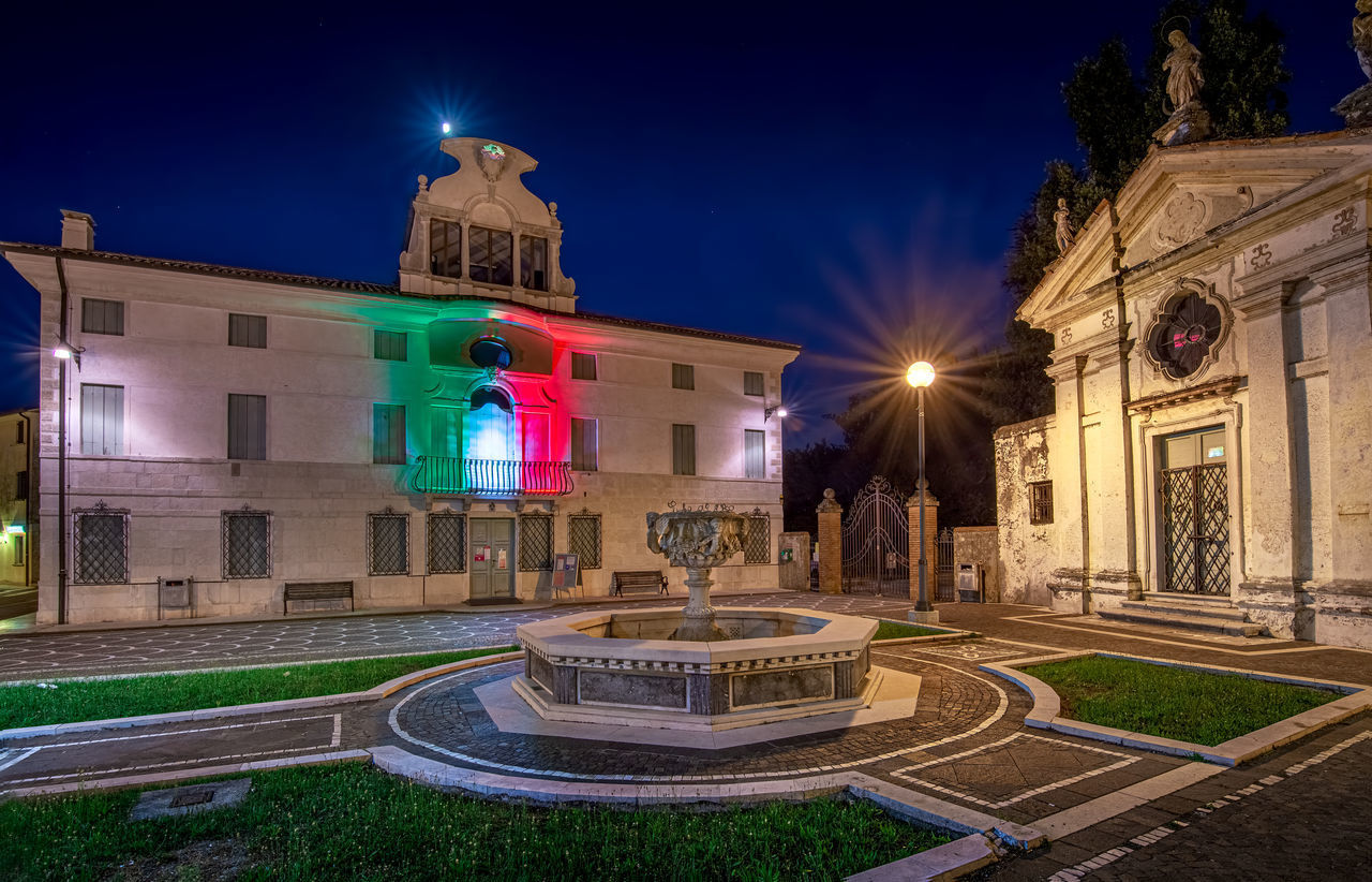 ILLUMINATED BUILDINGS AT NIGHT