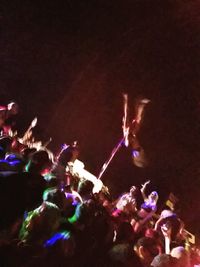 People enjoying music concert at night