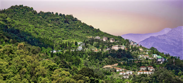 High angle view of townscape and mountains against sky